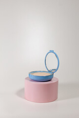 Beauty Loose Powder with Pink Podium and White Background