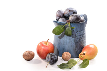 plum in a garden metal jug