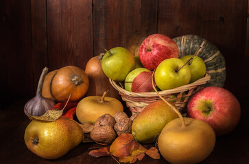 Naklejka na ściany i meble Fruits and vegetables on a dark wooden background