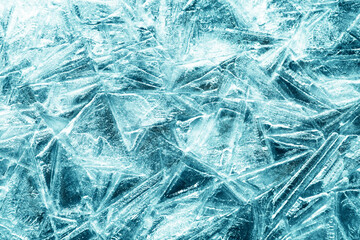 The texture of the ice surface. Winter background, festive background in the form of ice crystals, in azure color.
