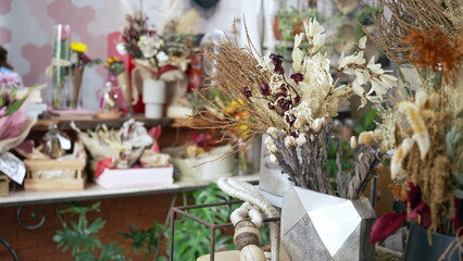 Flower shop interior. Closeup of elegant bouquet arrangement with diverse colors. Small business concept