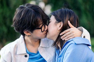 Young Asian Couple Kissing