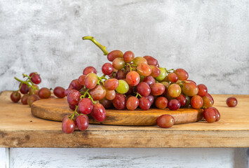 Still life with a bunch of ripe and tasty grapes.
