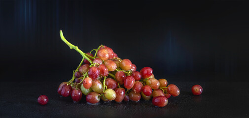 Still life with a bunch of ripe and tasty grapes.
