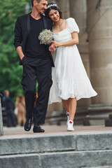 Fototapeta na wymiar Beautiful bride with his fiance is celebrating wedding outdoors