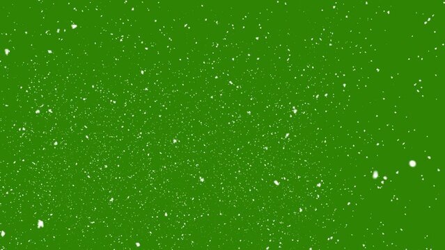 Snow falling on green background