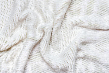 White macro photo of textured jersey and knitting of sweater or sweatshirt. Pattern and background for fashion Warm Autumn concept