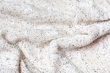 White macro photo of textured jersey and knitting of sweater or sweatshirt. Pattern and background for fashion Warm Autumn concept