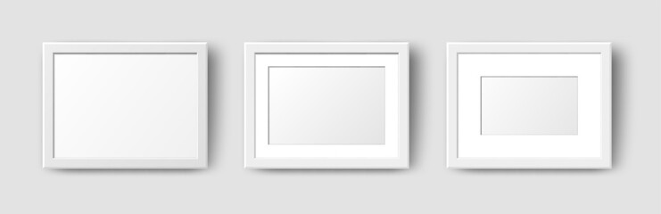 Realistic Horizontal Rectangle Empty Wall Photo Frames set. Vector white picture frame mockup template with shadow on grey background. Mockup for poster, banner, photo gallery, painting, presentation.