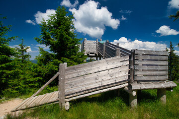 Lookout point at Certova hora with white clouds. Krkonose. Czech Republic.