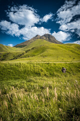 Dramatic view of high mountains and green field under the blue sky, Mt. Yufudake in Oita Prefecture in Japan, Travel or outdoor background