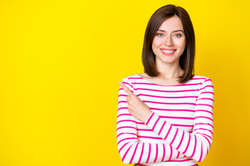 Closeup photo of young attractive smiling woman pointing empty space done teeth clinic isolated on...