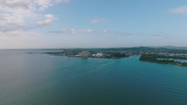 High angle aerial drone view of Gladstone, a coastal city in Central Queensland, Australia, and home to Queensland's largest multi-commodity shipping port, the Port of Gladstone.