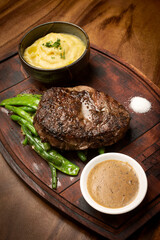 rib eye beef steak with butter sauce and gravy