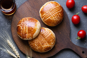 Traditional Turkish pastries pogaca on rustic table, famous bakery product