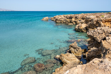 Fototapeta premium Small rocky beaches with clear and turquoise water in the natural oasis of Vendicari