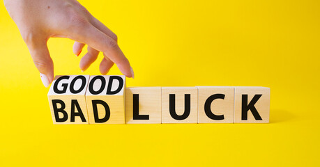 Good Luck and bad Luck symbol. Hand turns a cube and changes the words Bad Luck to Good Luck....