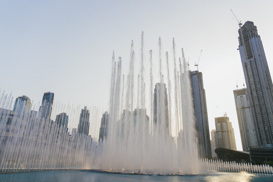 Dubai, United Arab Emirates, October 6, 2022 : Dubai Music Fountain next to the world's tallest building Burj Khalifa.