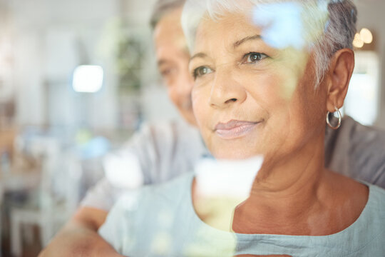 Woman Thinking In Home, Senior Couple Reflection In Window And Man Support Wife Grief In Brazil Retirement Care. Husband Hug Elderly Life Partner, Sad Lady With Anxiety Worry And Together Apartment