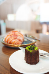 Green tea Caneles de bordeaux - traditional French sweet dessert.