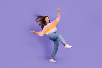 Fototapeta na wymiar Full body photo of cheerful adorable person stand one leg rejoice isolated on violet color background