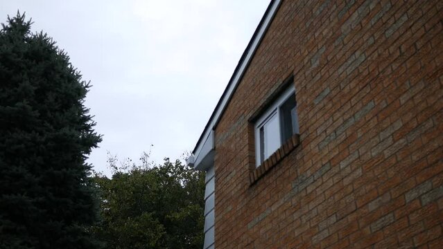 An establishing shot of a window of a 1950's American ranch home - Rear Facing