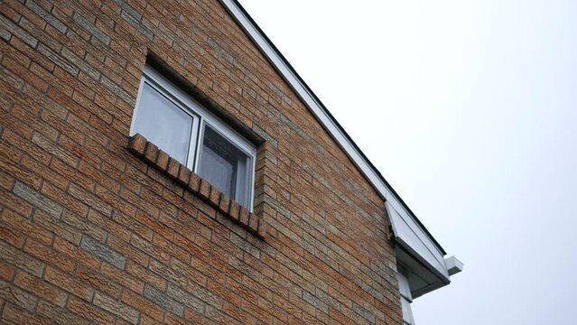 An Establishing Shot of a window of a 1950's American Ranch Home