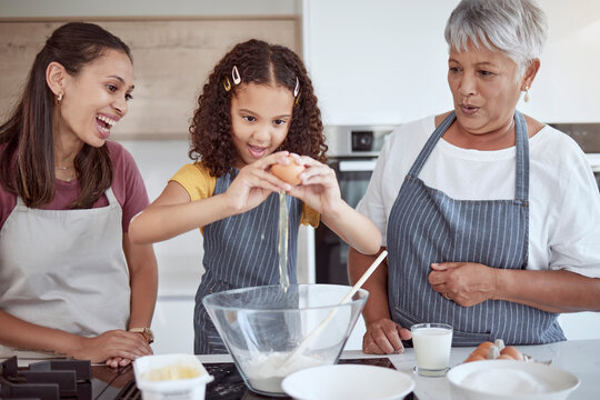 Happy family, child and grandmother cooking in kitchen with flour and egg food learning to make a cake or cookies with women support, love and care. Mexico kid in home baking together for mothers day