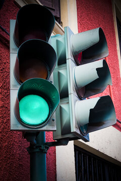 Green go light on traffic light on street corner