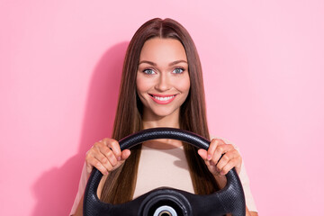 Closeup photo of young pretty girlish woman brown hair hold steering wheel driving lessons courses practicing positive isolated on bright pink color background