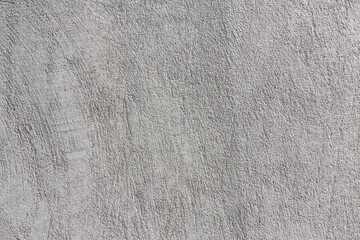 The background of the gray wall, stucco rough surface. Top view. Backgrount or texture for design