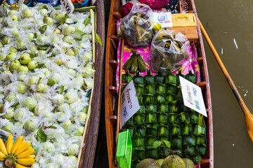 Traditional floating market local food Thai vendors selling fruits