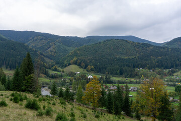 Fototapeta premium Panorama of the beautiful mountains. Village in the valley.
