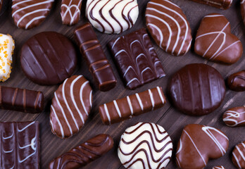 Composition of chocolate chip cookies of various shapes and chocolates top view