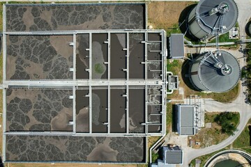 Aerial view of aeration tanks or activated sludge units, part of a water cleaning facility, at urban wastewater treatment plant