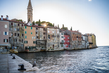 old, historic buildings of the historic old town of Rijeka from the sea at sunset
