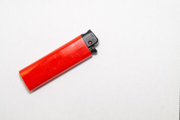Red old lighter on a white background