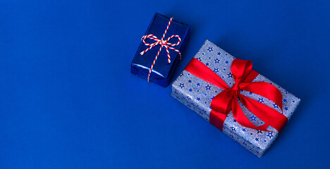 Fototapeta premium Happy Veterans Day concept. American flags with gift box against a blackboard background. November 11.