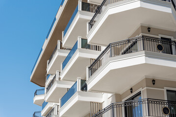 Part of a modern residential flat exterior of an apartment building. Detail of a new luxury home and residential complex.