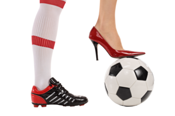 Soccer shoe and high-heeled shoe pressing a football