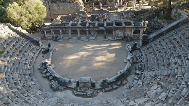 View of historical ruins, columns, ancient theater and temples in the ancient city of Priene.