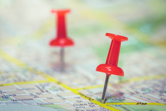 Thumbtacks on a roadmap