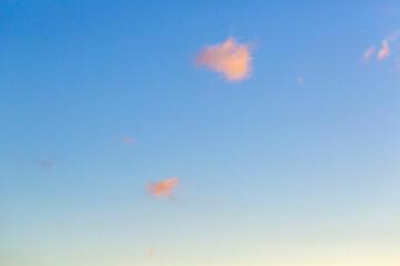 Fototapeta na wymiar Lonely clouds on the blue sky