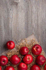 rustic wooden background with red apples and place for text, vertical frame