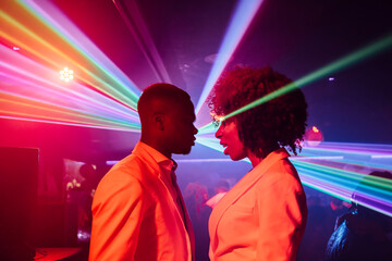 Ethnic couple dancing in nightclub