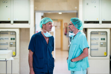 Two surgeons talking in hospital
