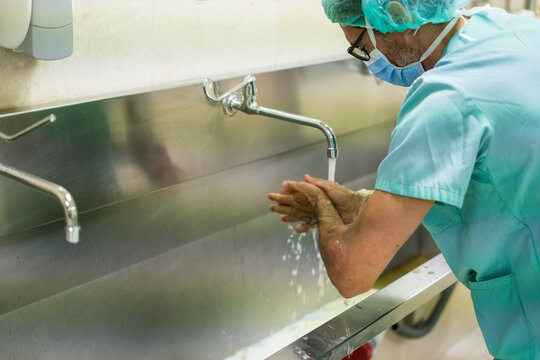 Surgeon washing hands