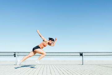 Stages of sportswoman running race on stadium