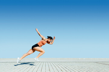 Stages of sportswoman running race on stadium