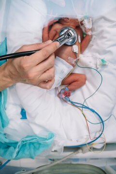 Doctor listening with stethoscope newborn baby
